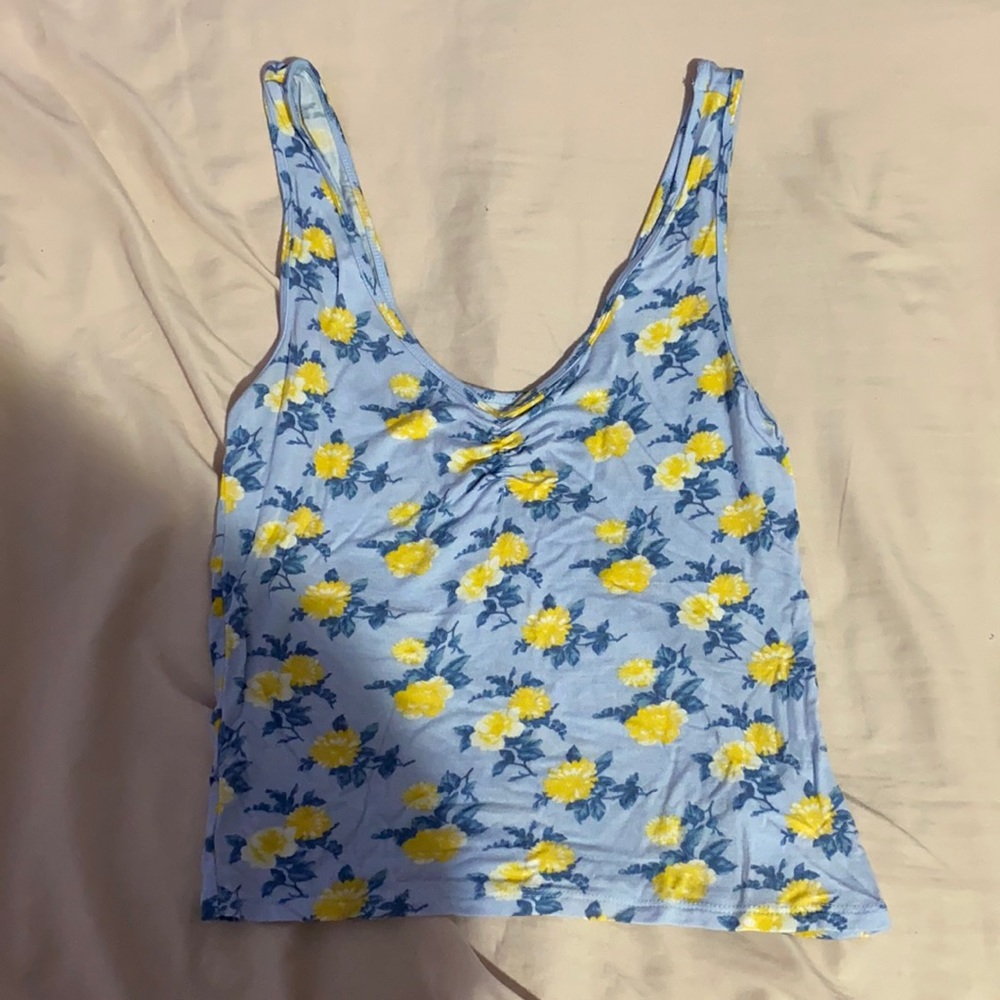 Blue crop top with flowers.